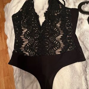 Windsor- Black and tan lace body suit with adjustable straps.